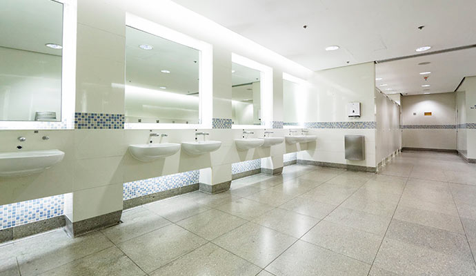 Clean grout lines on a commercial restroom floor