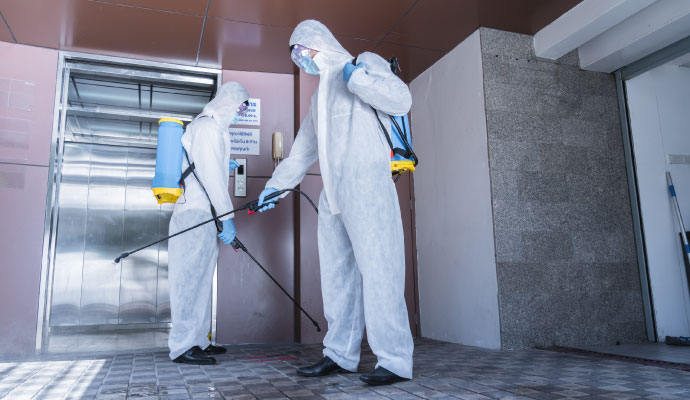 Commercial elevator disinfection service hazmat suits
