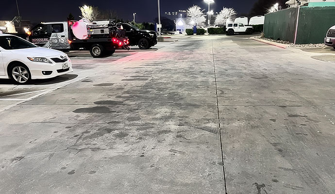 Commercial parking lot floor with oil stain spots