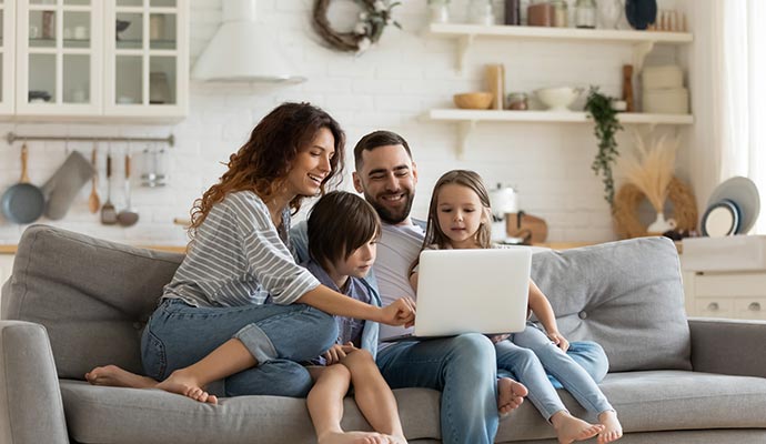 Happy family sitting together on a sofa