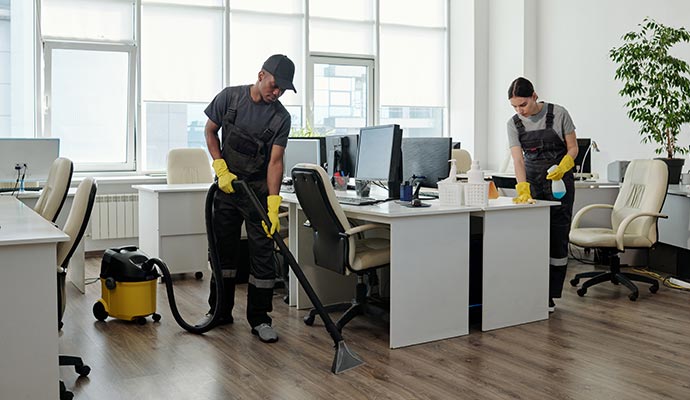 Professional cleaning team cleaning an office space