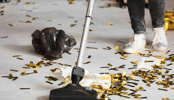 Person cleaning event area