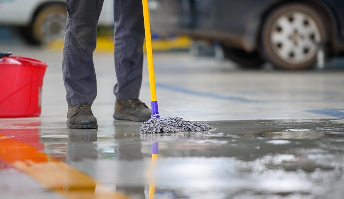 Cleaner mopping garage floor