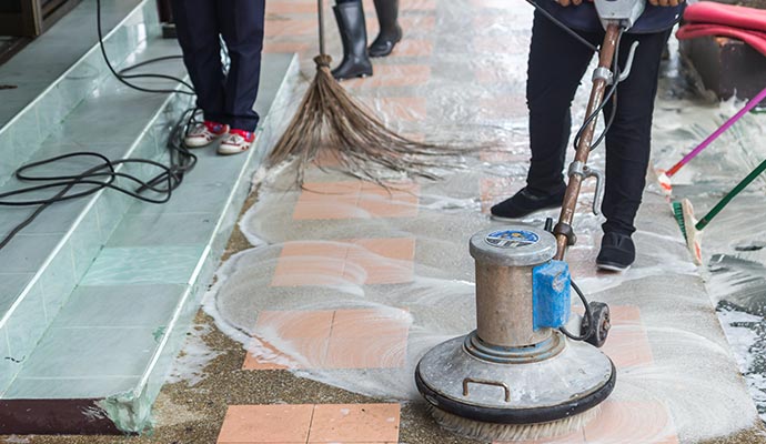 Cleaner scrubbing exterior tile floor