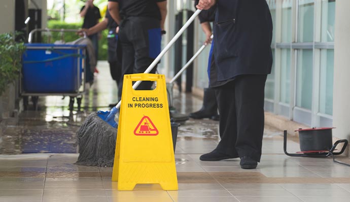 professional cleaners cleaning floor
