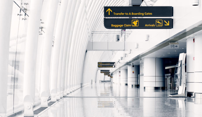A wide interior view of a modern airport terminal