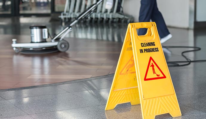 Professional worker cleaning floor
