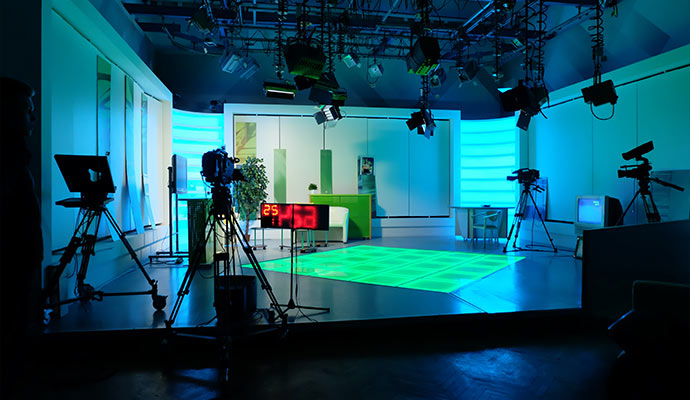 Modern television studio with professional cameras.
