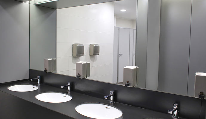 Clean commercial restroom mirrors and sinks