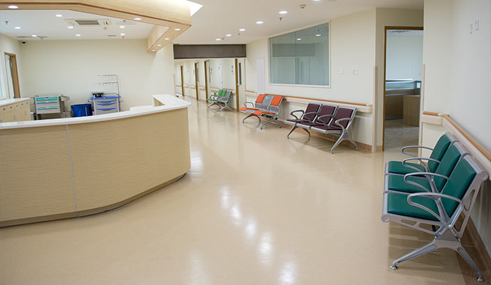 Clean healthcare lobby with reception desk and seating