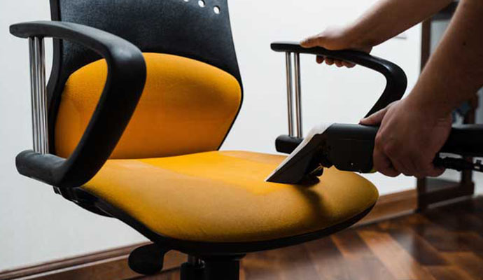 An expert cleaning an office chair