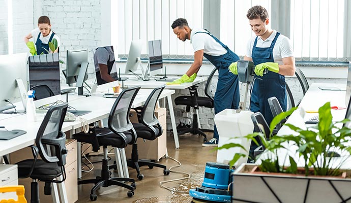 A professional team cleaning office space