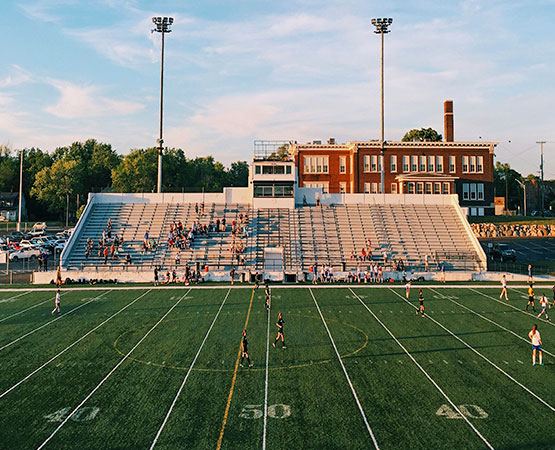 Outdoor sports field with stadium bleachers