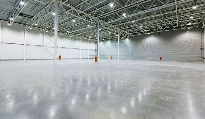Clean and polished concrete floor inside a large commercial warehouse