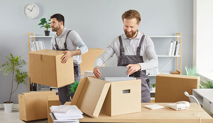 Professionals packing up contents of a commercial place